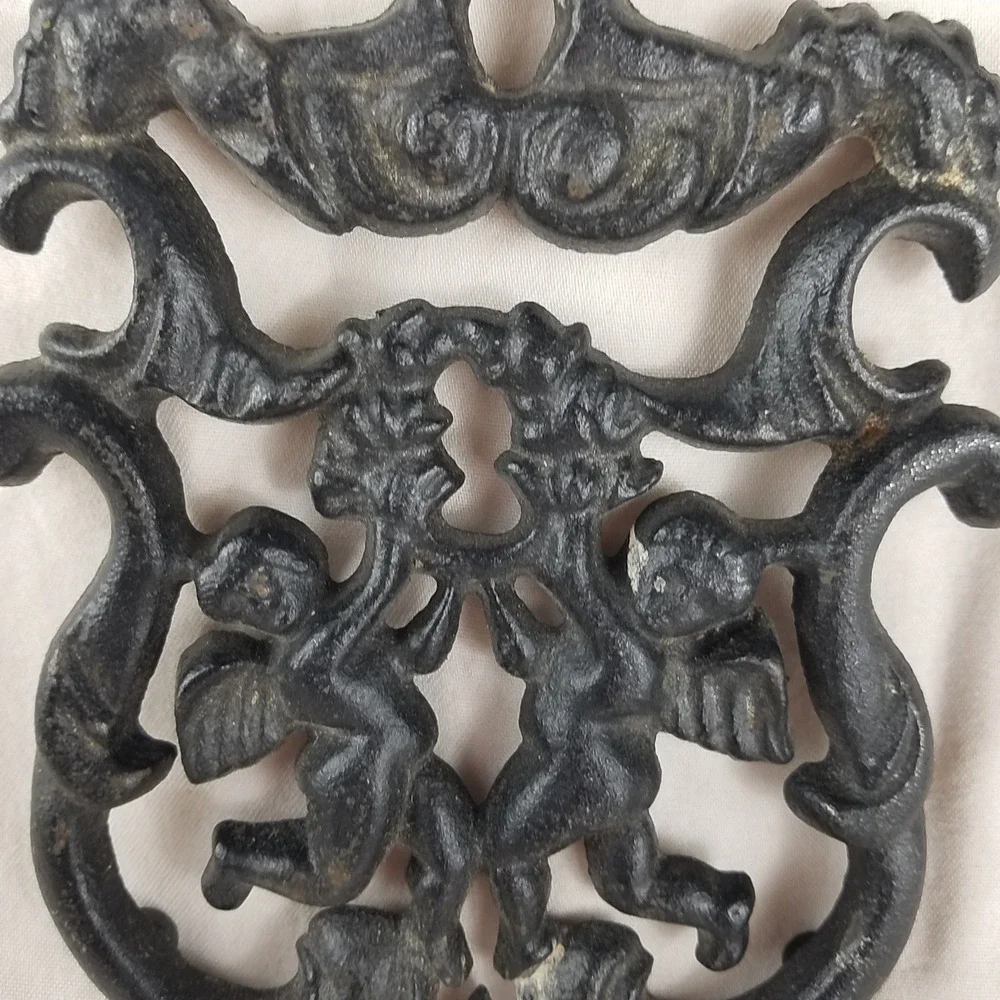 Vintage 1955 Cast Iron Trivet T-11 Cupid Sailor Cherub Black Metal Hot Plate 8.5
